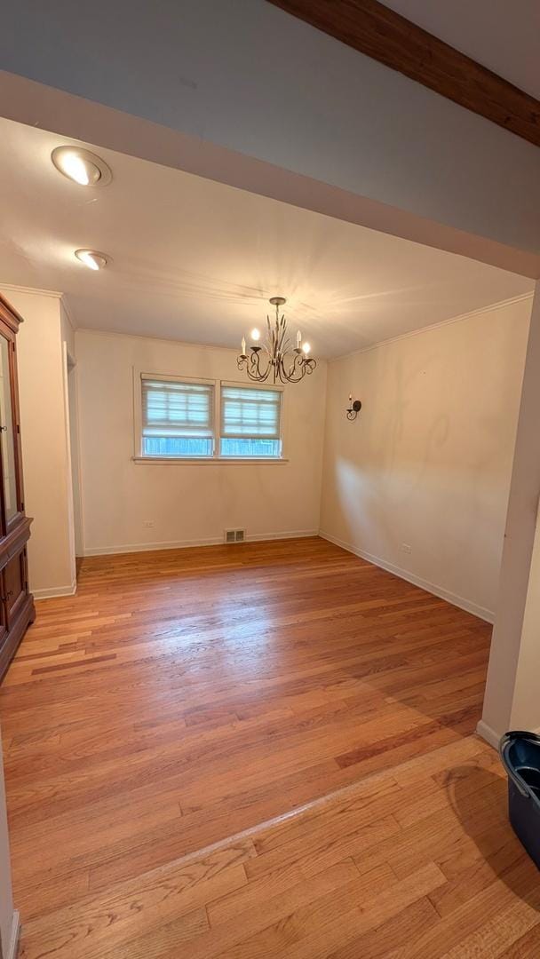 1430 Evergreen Ter, Glenview, IL 60025 - spare room with a chandelier and light wood finished floors