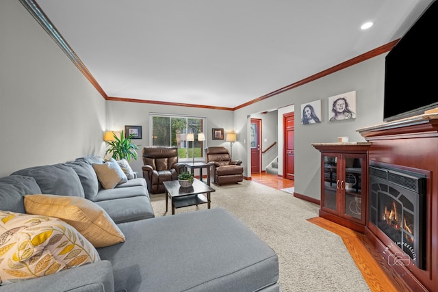 502 Burning Tree Ln, Naperville, IL 60563 - living area featuring crown molding, a lit fireplace, stairway, recessed lighting, and light carpet