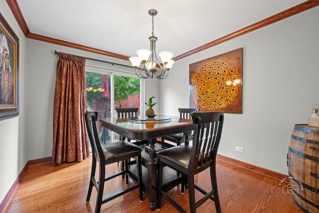 502 Burning Tree Ln, Naperville, IL 60563 - dining room with a chandelier, ornamental molding, and light wood-type flooring