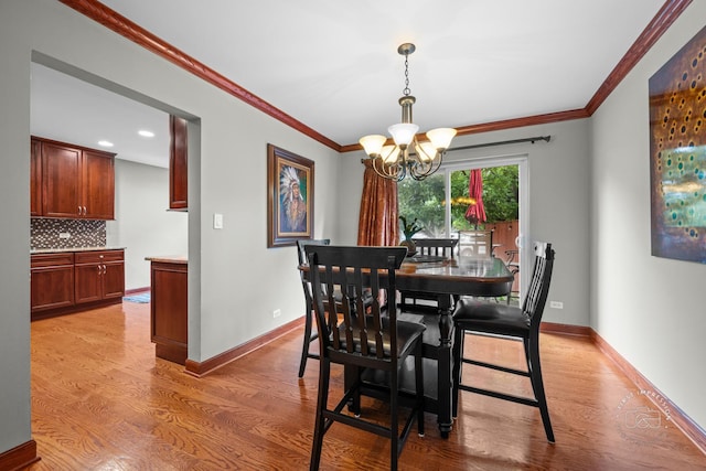 502 Burning Tree Ln, Naperville, IL 60563 - dining area with a chandelier, light wood-type flooring, crown molding, and recessed lighting