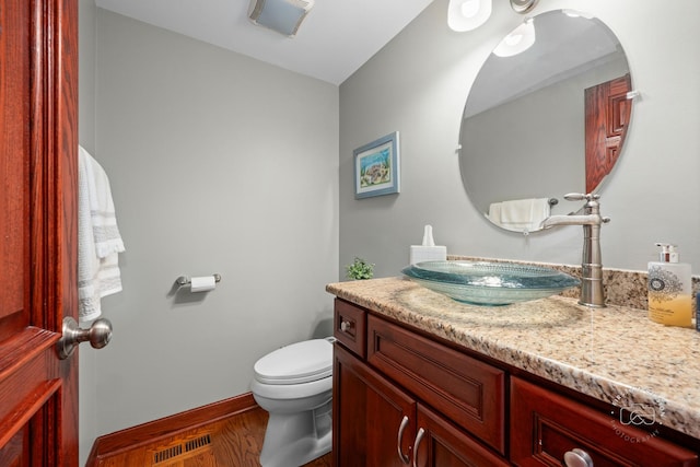 502 Burning Tree Ln, Naperville, IL 60563 - half bath featuring vanity and wood finished floors