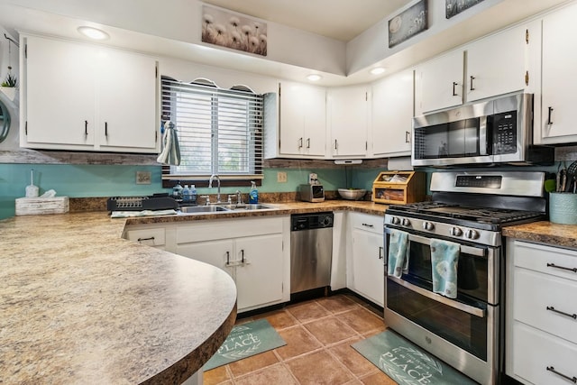 1934 Philip Dr, Dixon, IL 61021 - kitchen with stainless steel appliances, white cabinets, and recessed lighting
