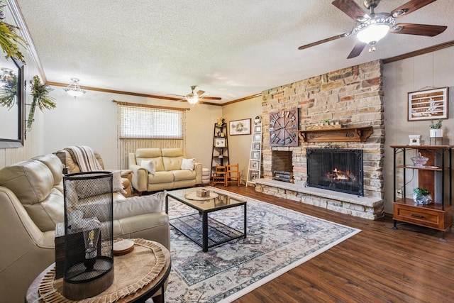 1934 Philip Dr, Dixon, IL 61021 - living area with a ceiling fan, a textured ceiling, ornamental molding, wood finished floors, and a stone fireplace