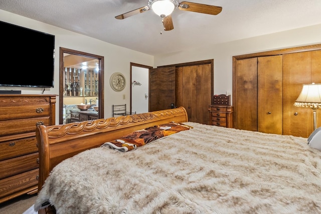 1934 Philip Dr, Dixon, IL 61021 - bedroom with multiple closets, ceiling fan, and connected bathroom