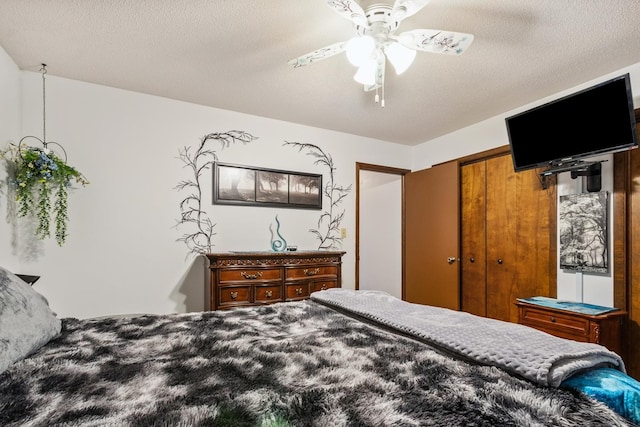 1934 Philip Dr, Dixon, IL 61021 - bedroom featuring ceiling fan, a closet, and a textured ceiling