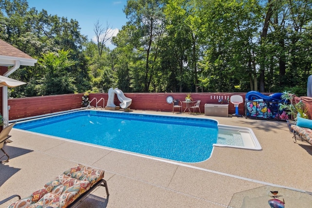 1934 Philip Dr, Dixon, IL 61021 - view of pool with a water slide, a fenced backyard, and a patio