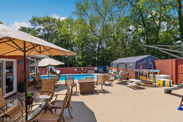1934 Philip Dr, Dixon, IL 61021 - fenced backyard featuring a patio and outdoor dining area