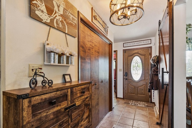 1934 Philip Dr, Dixon, IL 61021 - entrance foyer with a chandelier, light tile patterned floors, and a barn door