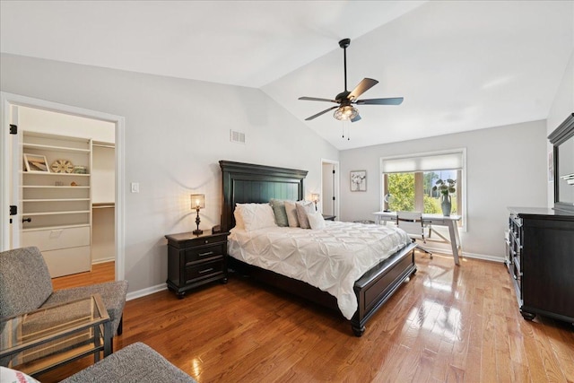 237 Carlisle Ave, Westmont, IL 60559 - bedroom with vaulted ceiling, wood finished floors, a walk in closet, and a ceiling fan