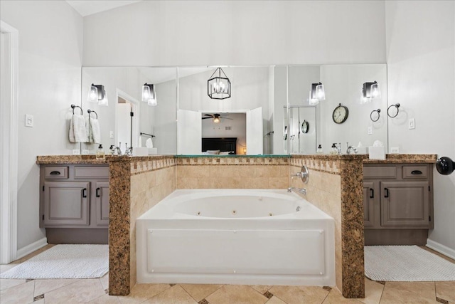 237 Carlisle Ave, Westmont, IL 60559 - bathroom with a ceiling fan, a jetted tub, tile patterned floors, and vanity