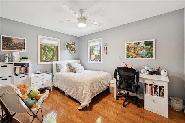 237 Carlisle Ave, Westmont, IL 60559 - bedroom featuring multiple windows, light wood-style floors, and a ceiling fan