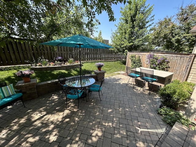 237 Carlisle Ave, Westmont, IL 60559 - fenced backyard with outdoor dining space and a patio