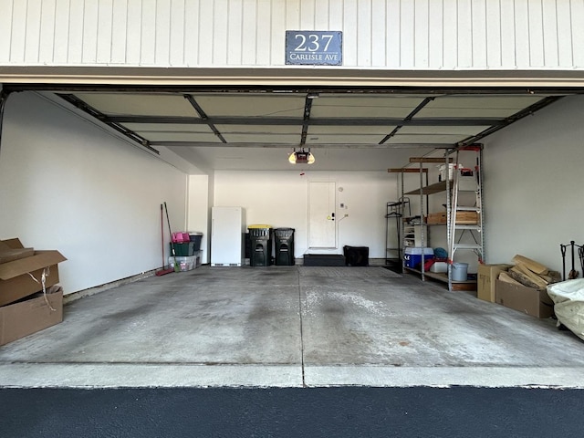 237 Carlisle Ave, Westmont, IL 60559 - garage with freestanding refrigerator and a garage door opener