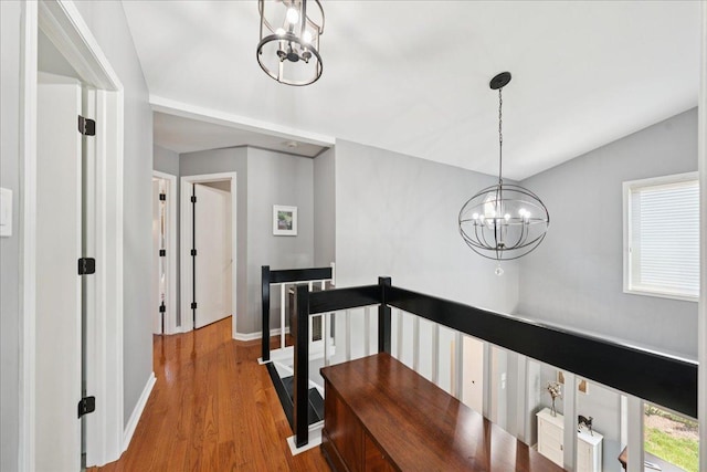 237 Carlisle Ave, Westmont, IL 60559 - corridor featuring a chandelier, an upstairs landing, and wood finished floors