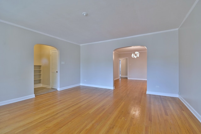 7851 W Cressett Dr, Elmwood Park, IL 60707 - empty room with arched walkways, ornamental molding, and light wood finished floors