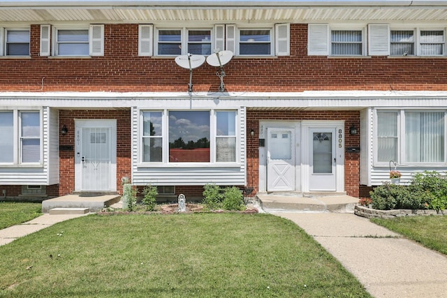8803 N Grand St, Niles, IL 60714 - entrance to property featuring a lawn and brick siding