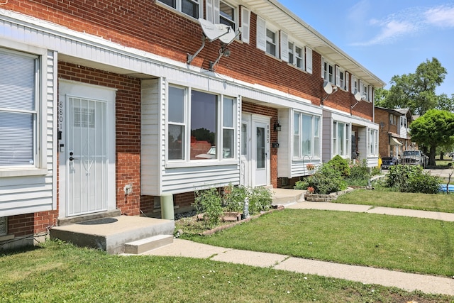 8803 N Grand St, Niles, IL 60714 - view of front of house with brick siding and a front yard