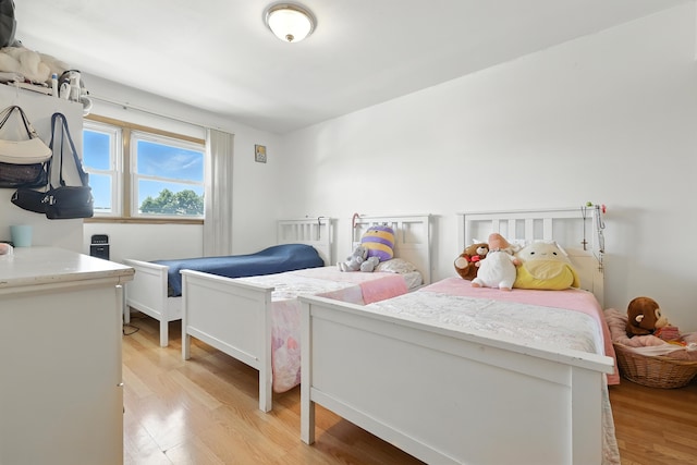 8803 N Grand St, Niles, IL 60714 - bedroom with light wood-style flooring