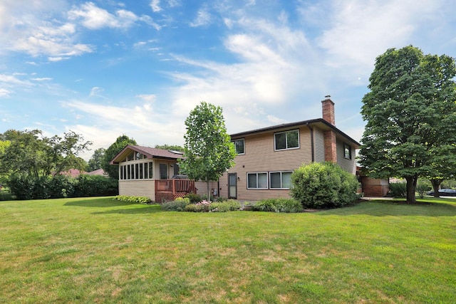 740 Ruskin Dr, Elk Grove Village, IL 60007 - back of house featuring a chimney, a yard, and a wooden deck
