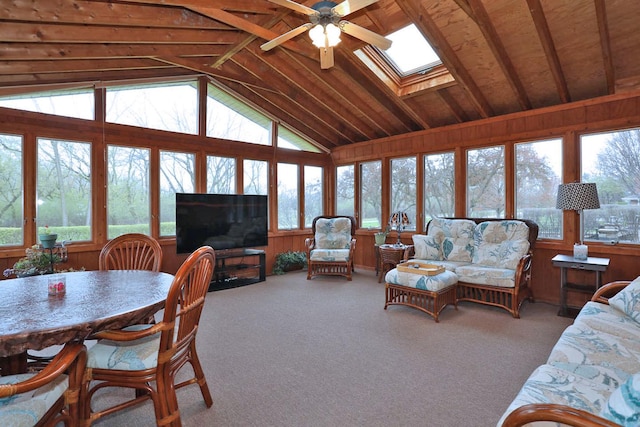 740 Ruskin Dr, Elk Grove Village, IL 60007 - living area featuring a skylight, vaulted ceiling, ceiling fan, wooden walls, and carpet floors
