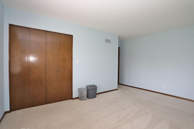 740 Ruskin Dr, Elk Grove Village, IL 60007 - unfurnished bedroom featuring a closet and light carpet