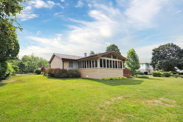 740 Ruskin Dr, Elk Grove Village, IL 60007 - rear view of property with a yard and a sunroom
