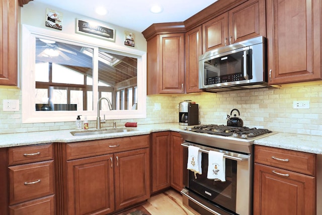 740 Ruskin Dr, Elk Grove Village, IL 60007 - kitchen featuring stainless steel appliances, decorative backsplash, brown cabinetry, light stone countertops, and recessed lighting