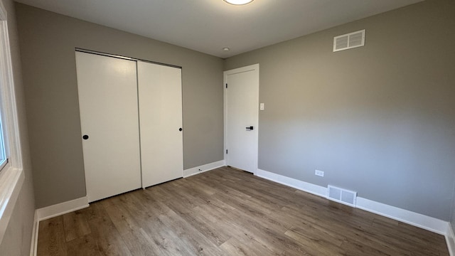 626 E 194th St, Glenwood, IL 60425 - unfurnished bedroom featuring wood finished floors and a closet