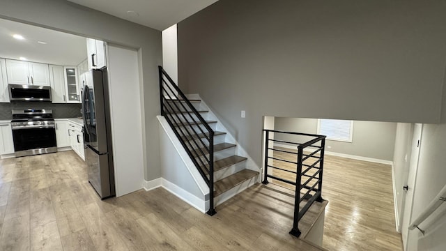 626 E 194th St, Glenwood, IL 60425 - stairway featuring wood finished floors and recessed lighting