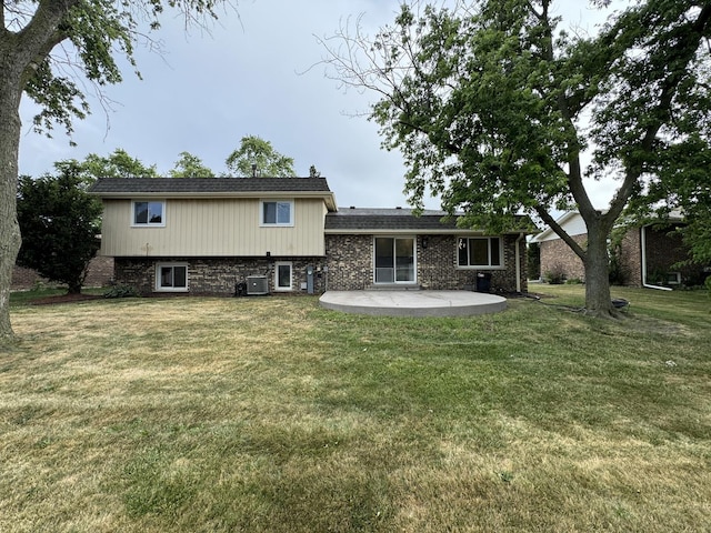 626 E 194th St, Glenwood, IL 60425 - rear view of property with a patio area and a lawn