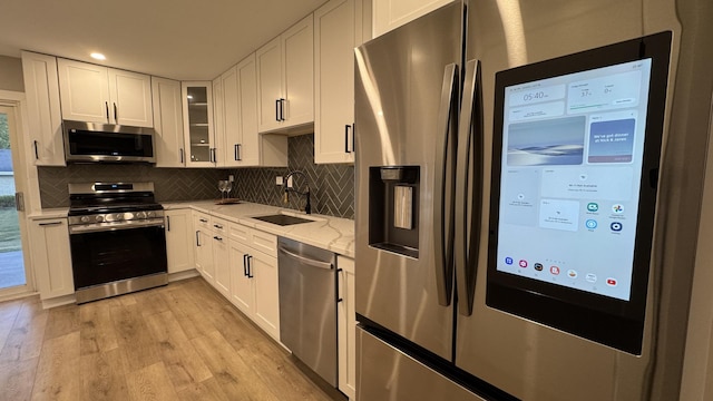 626 E 194th St, Glenwood, IL 60425 - kitchen with stainless steel appliances, light wood-type flooring, white cabinets, tasteful backsplash, and recessed lighting