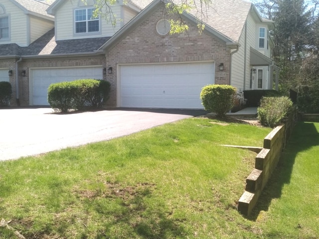 5434 Ashbrook Place -, Downers Grove, IL 60515 - view of front of property featuring brick siding, driveway, a front yard, roof with shingles, and an attached garage