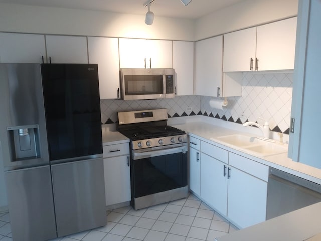 5434 Ashbrook Place -, Downers Grove, IL 60515 - kitchen featuring appliances with stainless steel finishes, light countertops, white cabinetry, tasteful backsplash, and light tile patterned floors