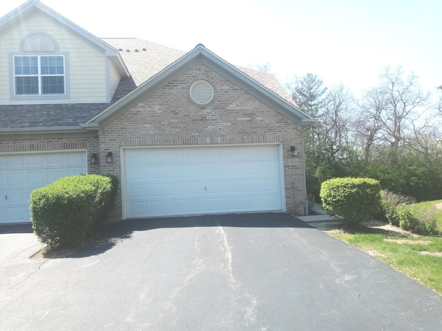 5434 Ashbrook Place -, Downers Grove, IL 60515 - view of front of house with brick siding, a shingled roof, asphalt driveway, and a garage
