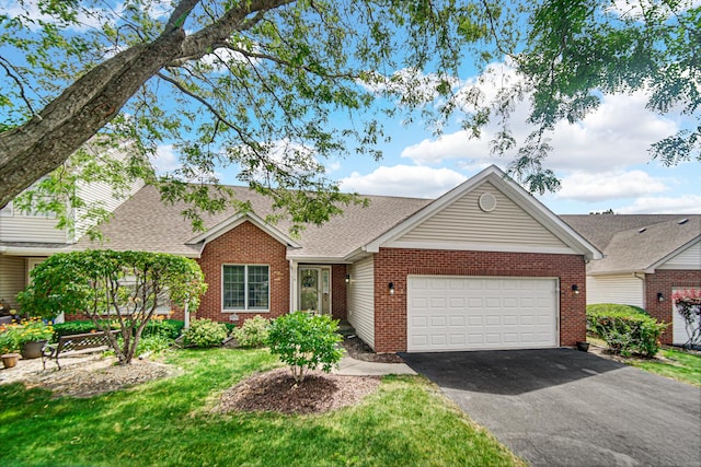 2718 Lake Side Cir, Joliet, IL 60431 - ranch-style house featuring brick siding, driveway, roof with shingles, a garage, and a front lawn
