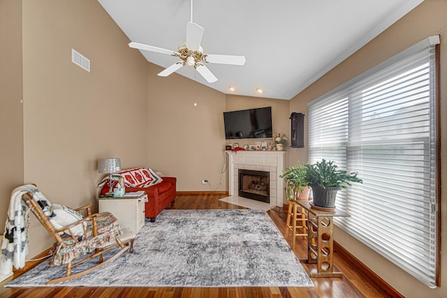 2718 Lake Side Cir, Joliet, IL 60431 - sitting room featuring lofted ceiling, a ceiling fan, wood finished floors, and a tile fireplace