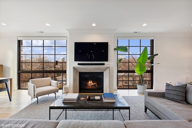 555 W Armitage Ave Unit 2W, Chicago, IL 60614 - living room with a glass covered fireplace, wood finished floors, and recessed lighting