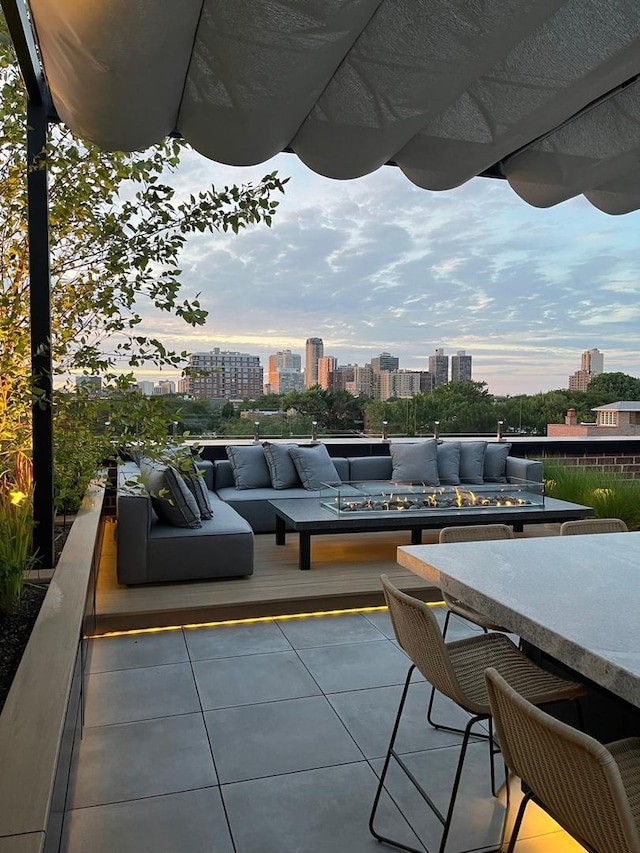 555 W Armitage Ave Unit 2W, Chicago, IL 60614 - view of patio featuring a city view and an outdoor living space with a fire pit