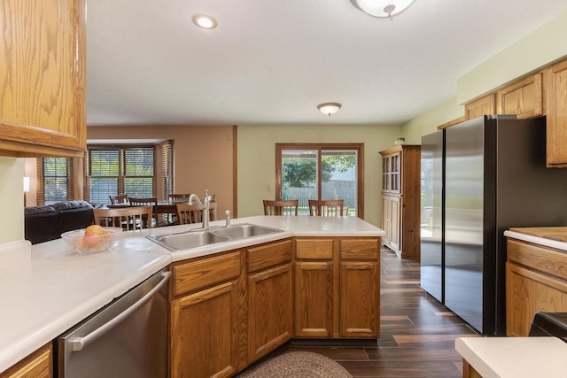 2805 Polo Rd, Bloomington, IL 61704 - kitchen with stainless steel appliances, light countertops, dark wood-style flooring, recessed lighting, and brown cabinets