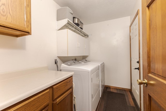 2805 Polo Rd, Bloomington, IL 61704 - laundry area featuring cabinet space, washer and clothes dryer, and dark wood-type flooring