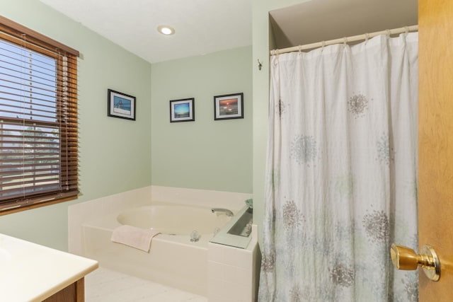 2805 Polo Rd, Bloomington, IL 61704 - bathroom with vanity, a garden tub, and a shower with curtain