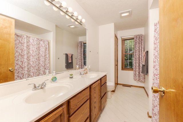 2805 Polo Rd, Bloomington, IL 61704 - full bathroom featuring double vanity and toilet