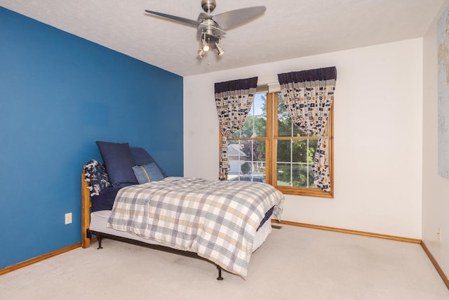 2805 Polo Rd, Bloomington, IL 61704 - carpeted bedroom featuring baseboards and a ceiling fan