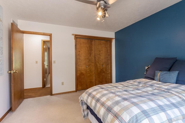 2805 Polo Rd, Bloomington, IL 61704 - bedroom featuring light colored carpet, a closet, and a ceiling fan