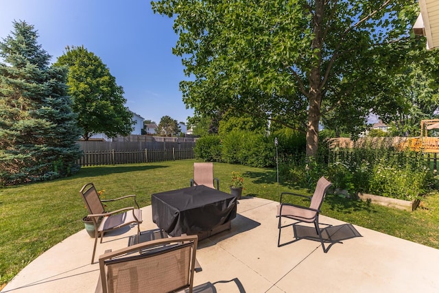 2805 Polo Rd, Bloomington, IL 61704 - fenced backyard with a patio and a grill