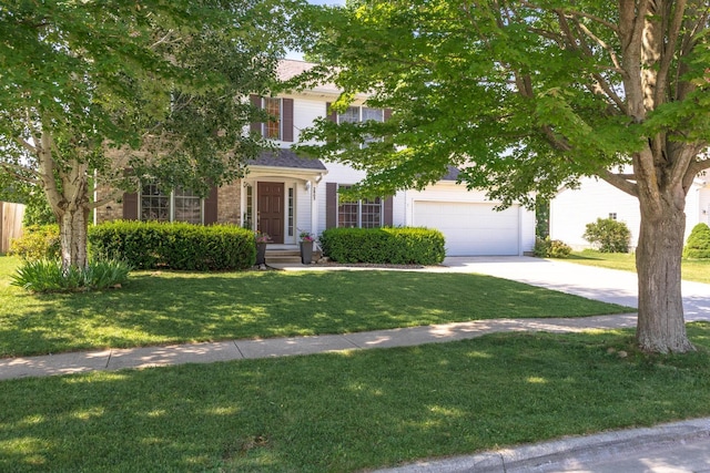 2805 Polo Rd, Bloomington, IL 61704 - view of property hidden behind natural elements with concrete driveway, a front lawn, and an attached garage