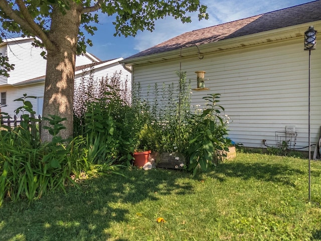 2805 Polo Rd, Bloomington, IL 61704 - view of property exterior with a yard and a shingled roof