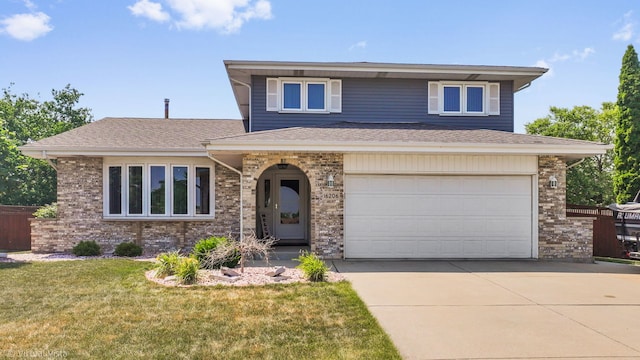 16206 Everdon Dr, Tinley Park, IL 60477 - view of front of home featuring an attached garage, driveway, a front lawn, and a shingled roof