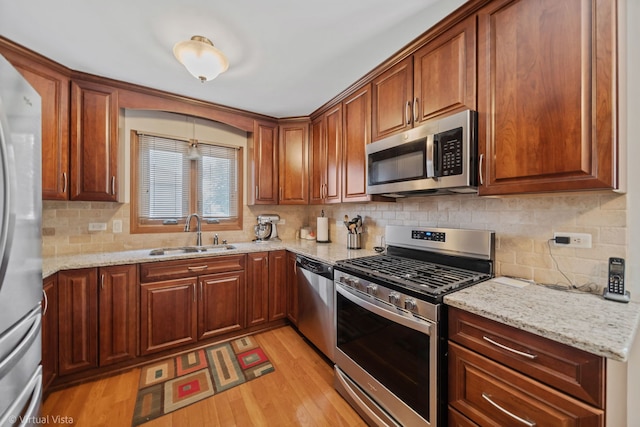 16206 Everdon Dr, Tinley Park, IL 60477 - kitchen with stainless steel appliances, light wood-type flooring, decorative backsplash, and light stone countertops