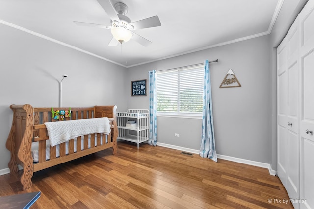 25909 S Woodrush Way, Channahon, IL 60410 - bedroom featuring ornamental molding, wood finished floors, a closet, and ceiling fan